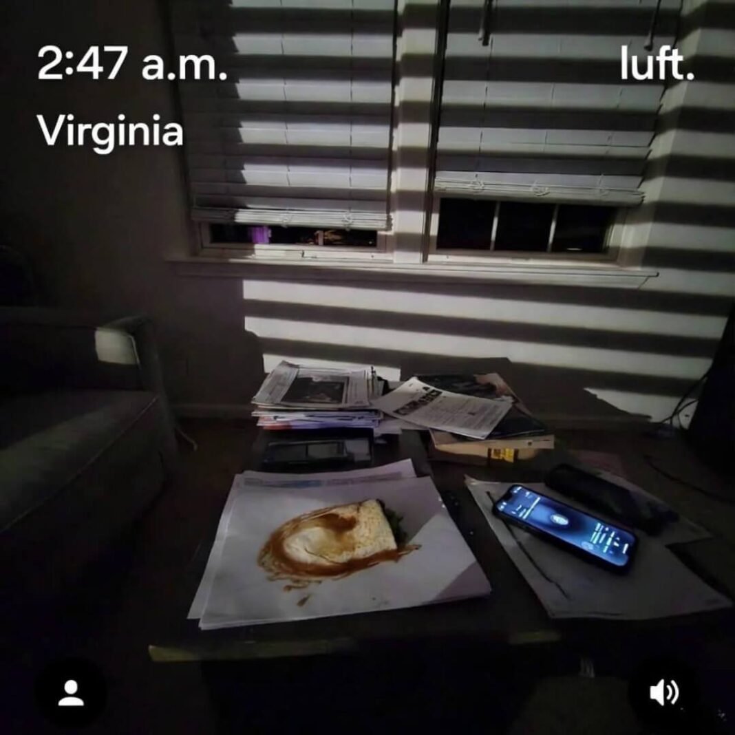 Greasy burrito on leaked docs, phone alert glows.